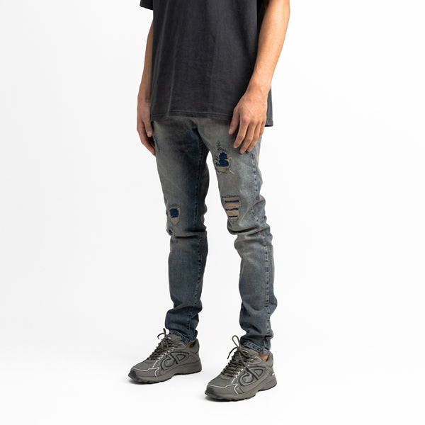 Destroyed Repaired Sand Jeans