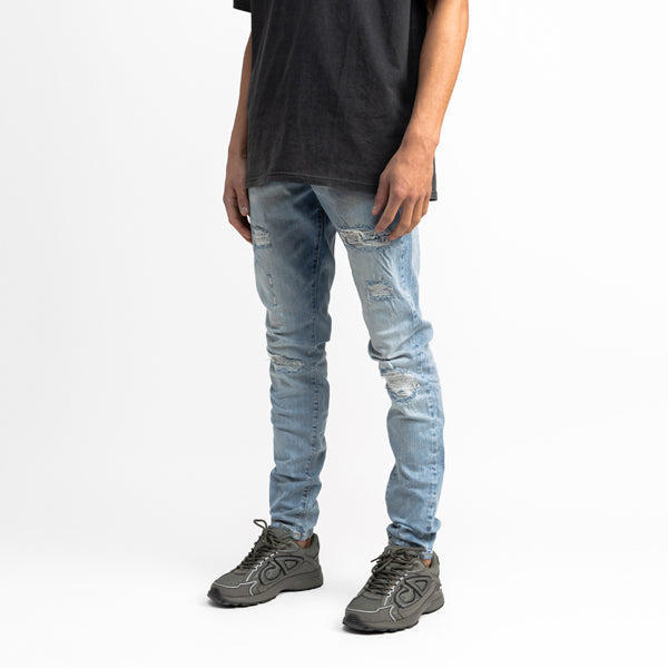 Destroyed Repaired Light Blue Jeans